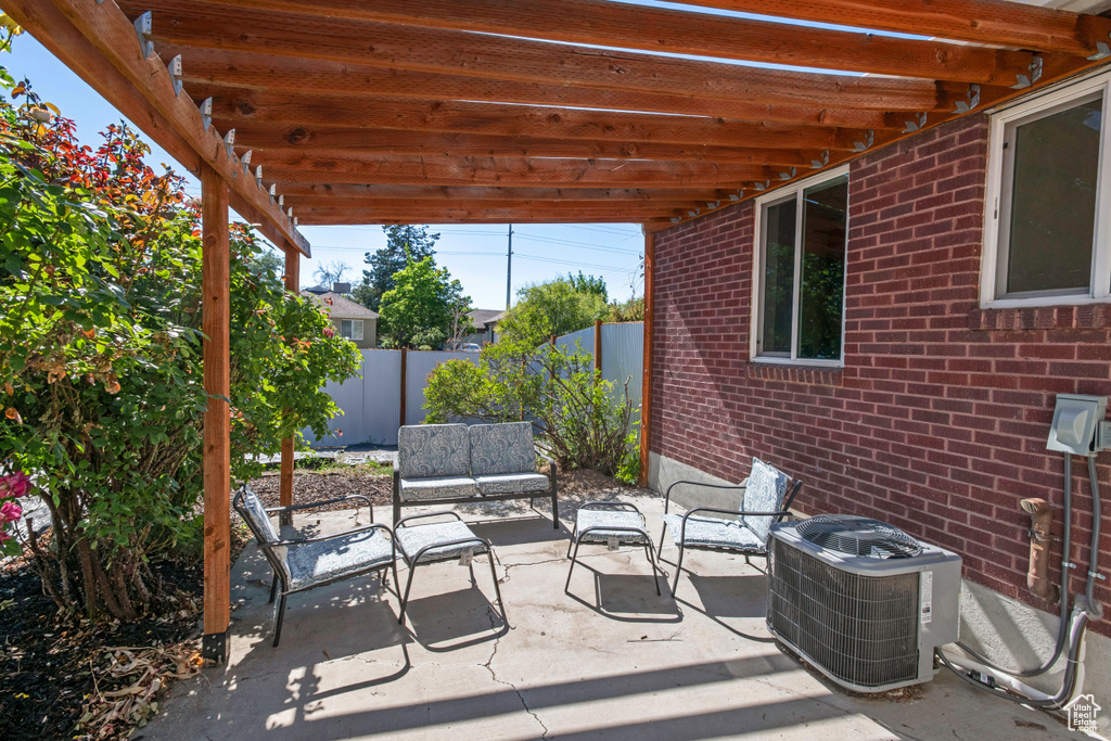 View of patio featuring central air condition unit and an outdoor hangout area