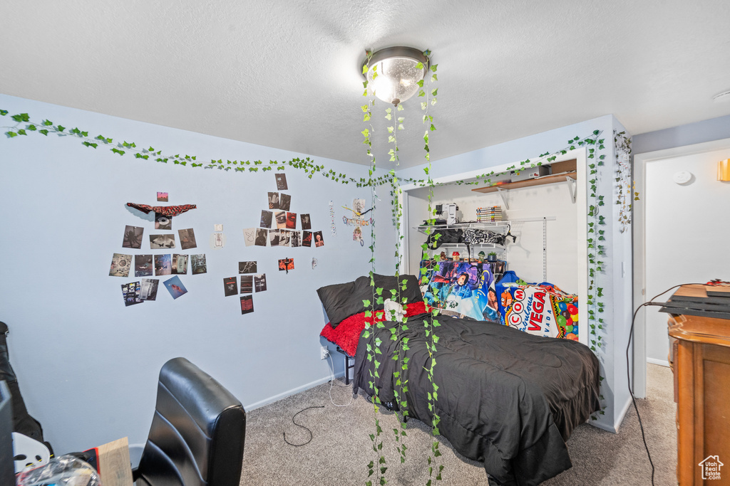 Bedroom with carpet and baseboards