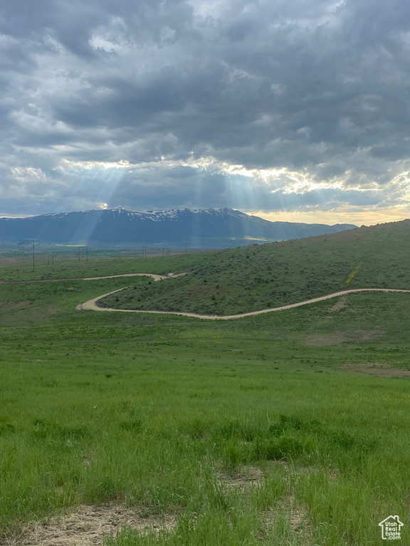 View of mountain backdrop with rural landscape