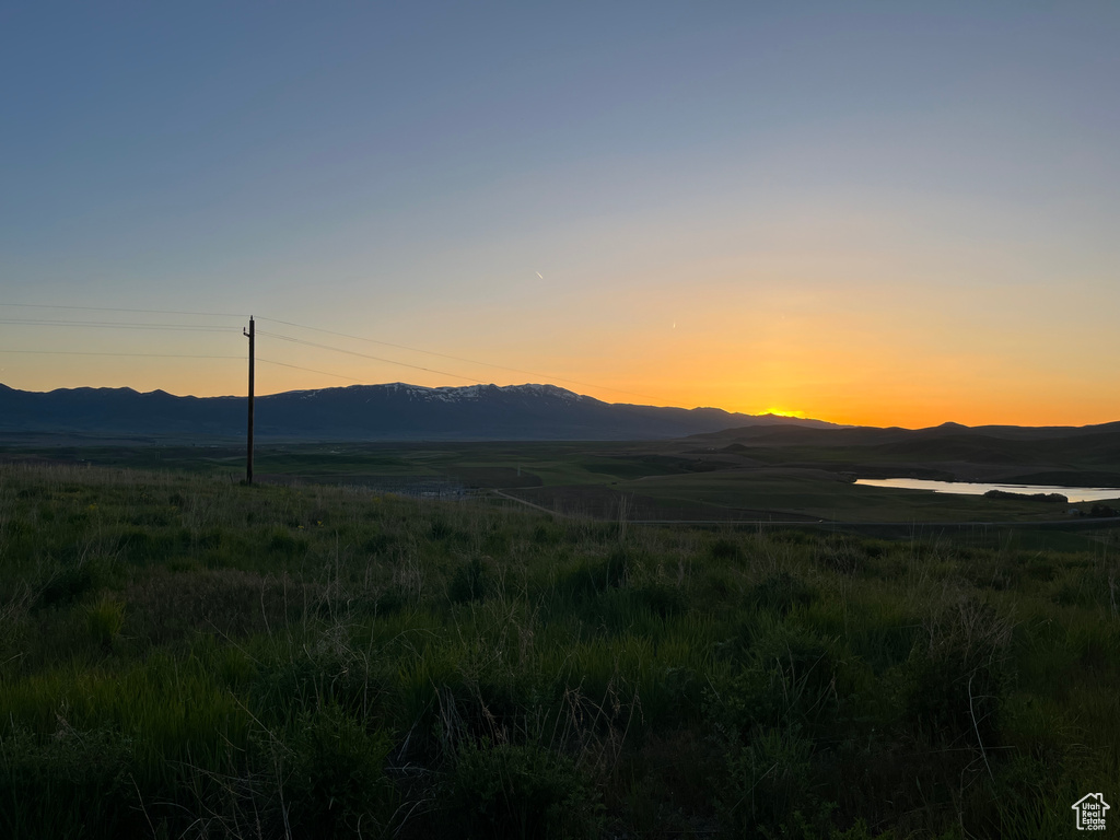 View of mountain background featuring rural landscape
