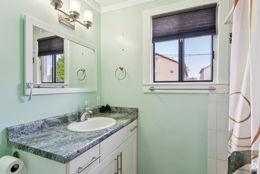 Bathroom with vanity and a shower with curtain