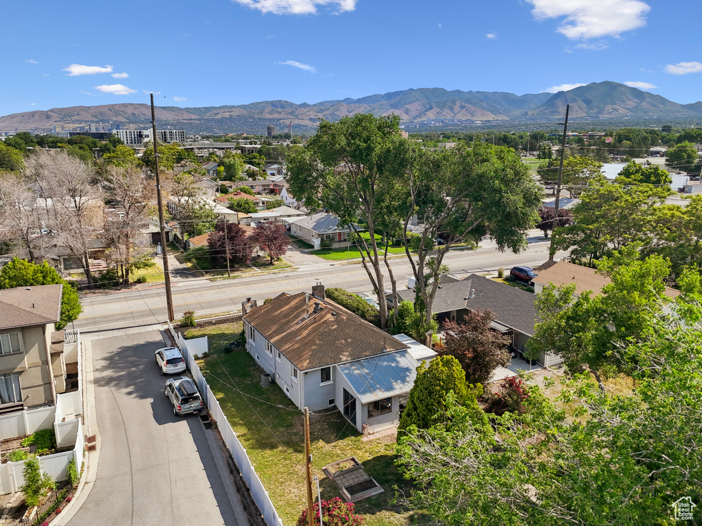 Aerial perspective of suburban area with a mountain backdrop