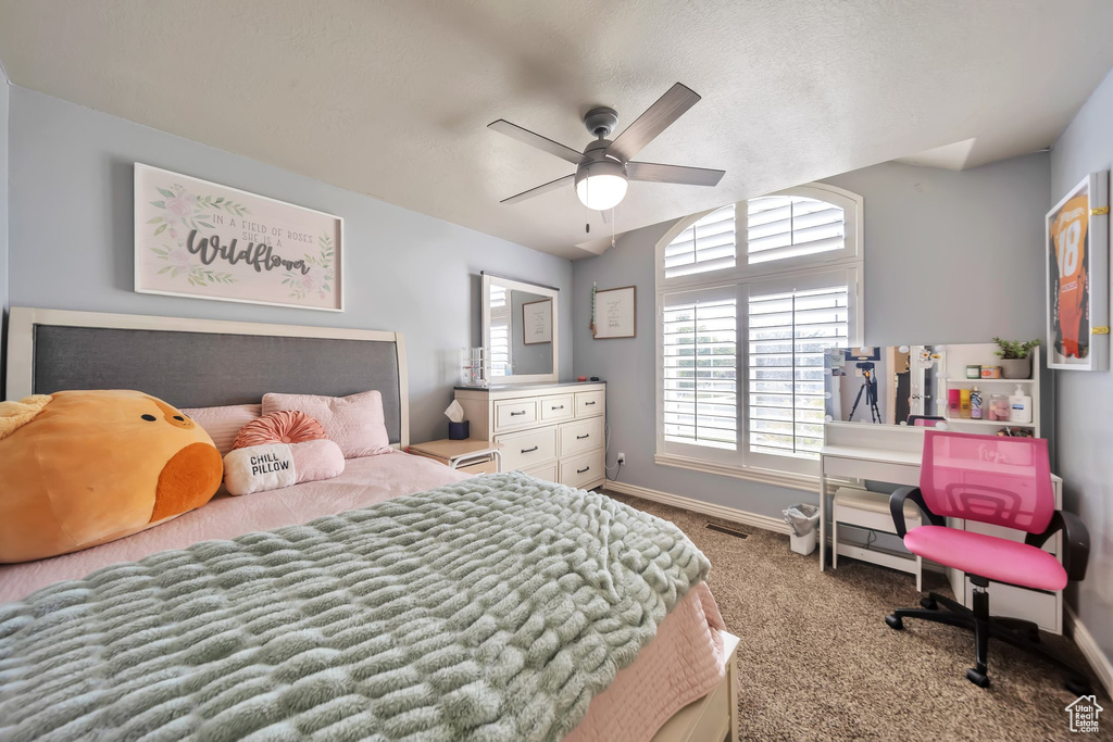 Bedroom featuring carpet and ceiling fan