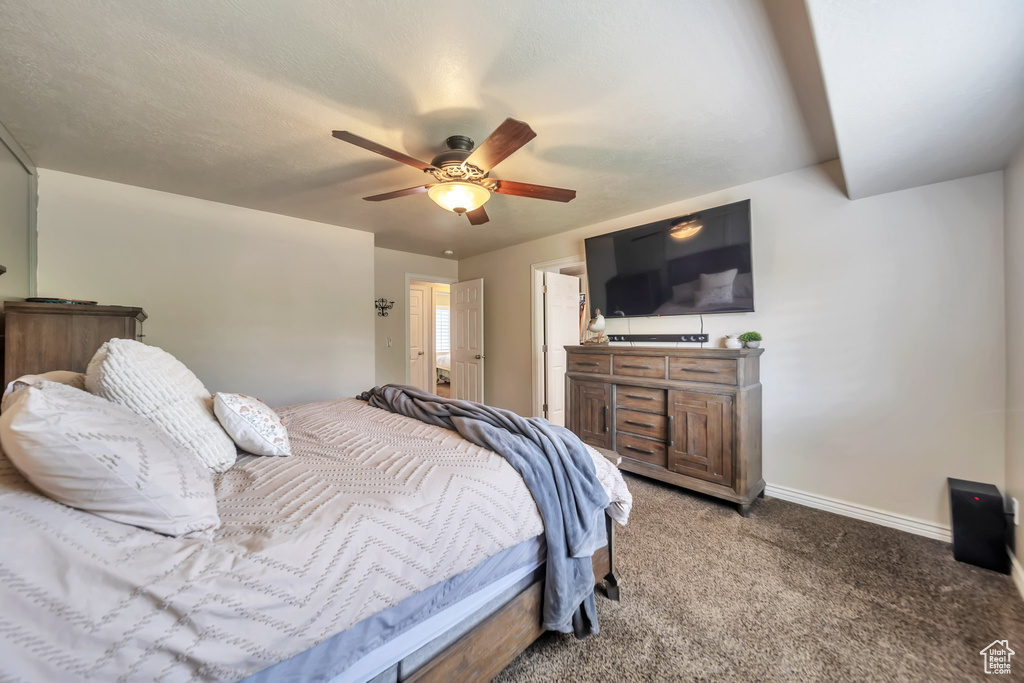 Bedroom featuring light carpet and ceiling fan