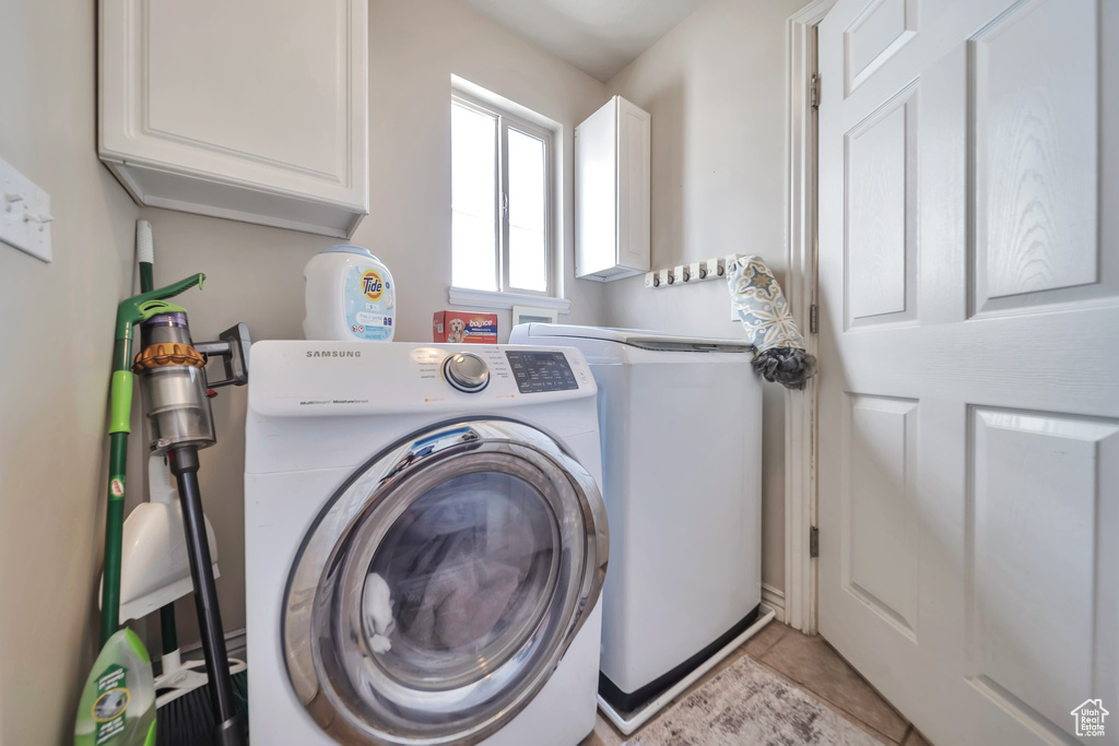 Laundry room with washer / clothes dryer and cabinet space