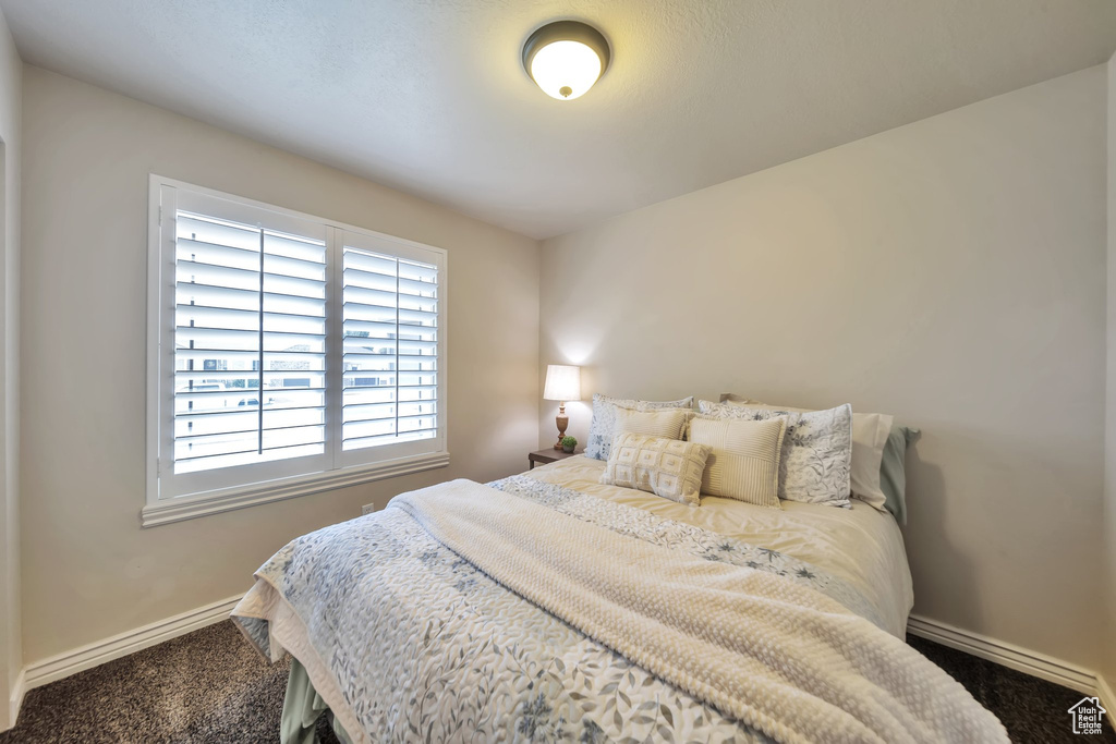 Bedroom with carpet and baseboards