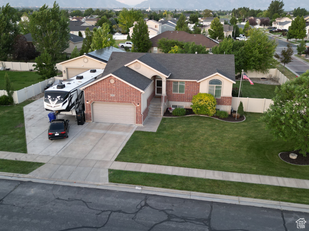 Aerial perspective of suburban area featuring a mountain backdrop