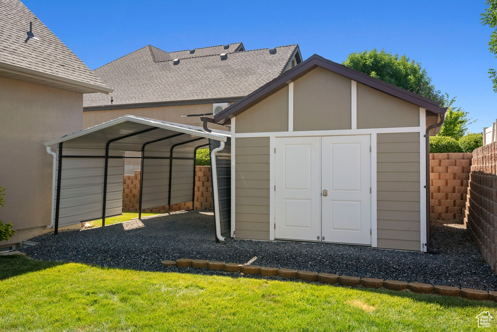 View of shed featuring a carport