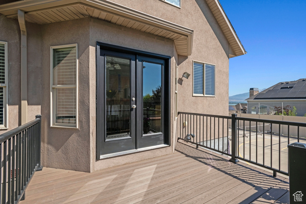 Wooden deck featuring a mountain view and french doors