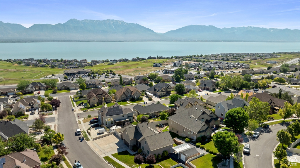 Aerial perspective of suburban area with a water and mountain view