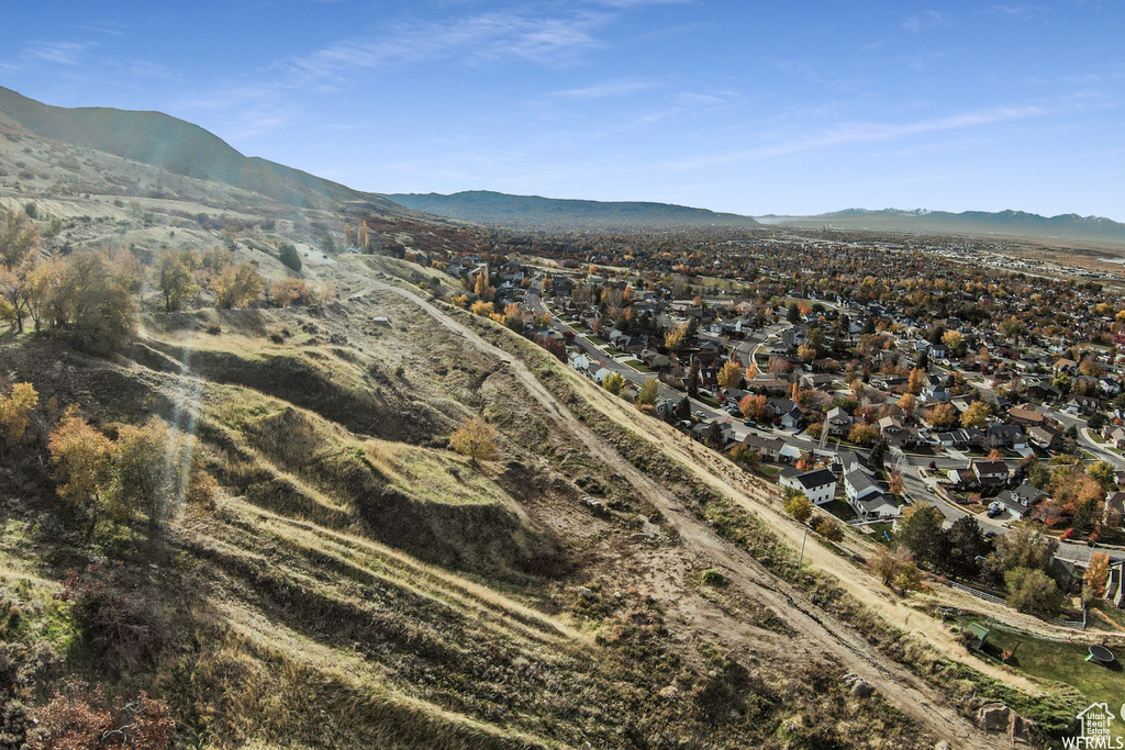 View of mountain backdrop featuring nearby suburban area