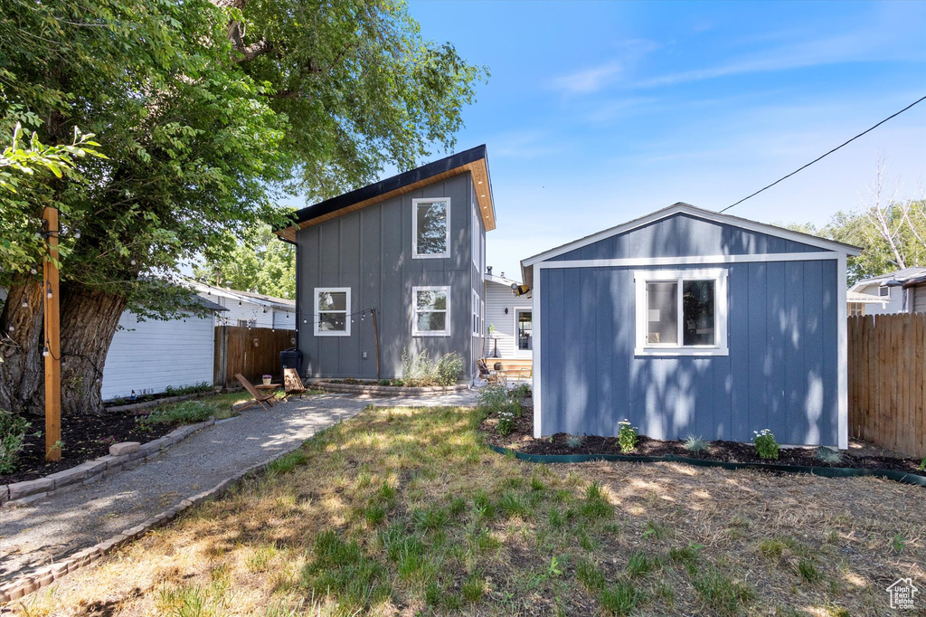 Rear view of property with an outdoor structure