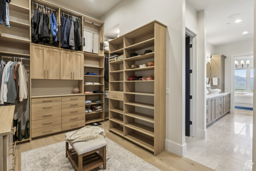 Walk in closet featuring light wood-style flooring