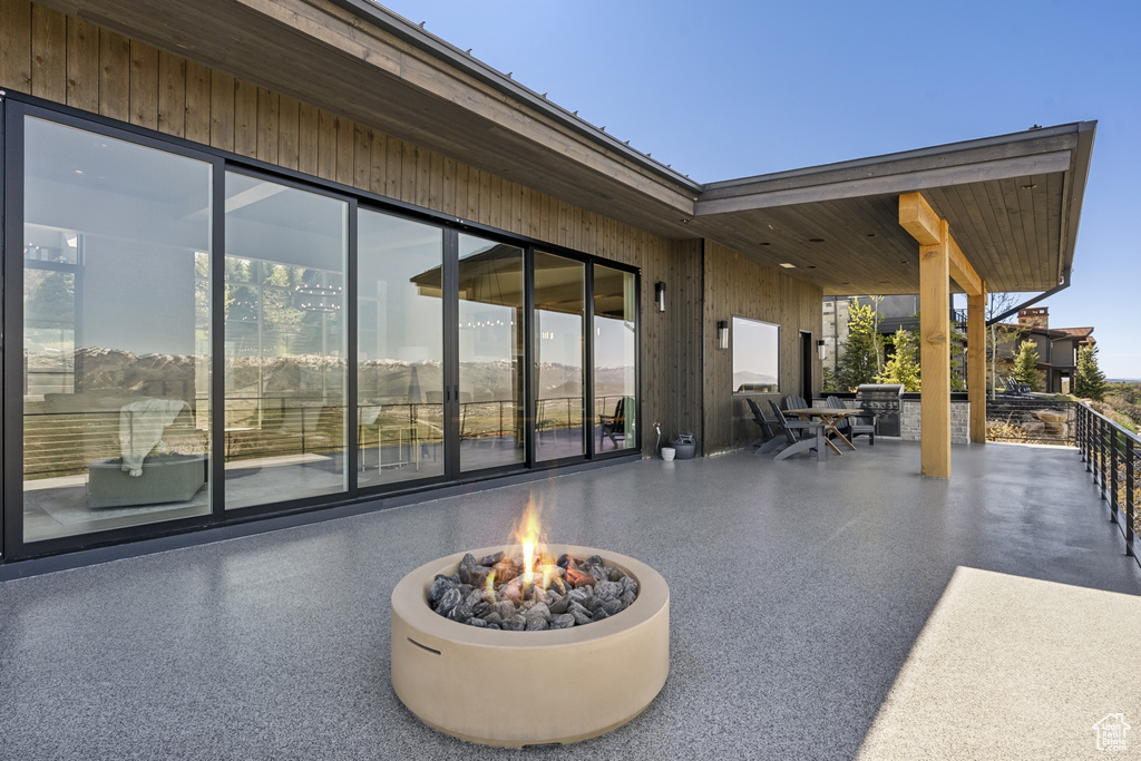 View of patio / terrace featuring an outdoor fire pit