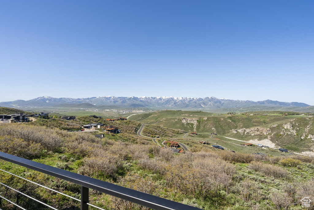 View of mountain backdrop with rural landscape