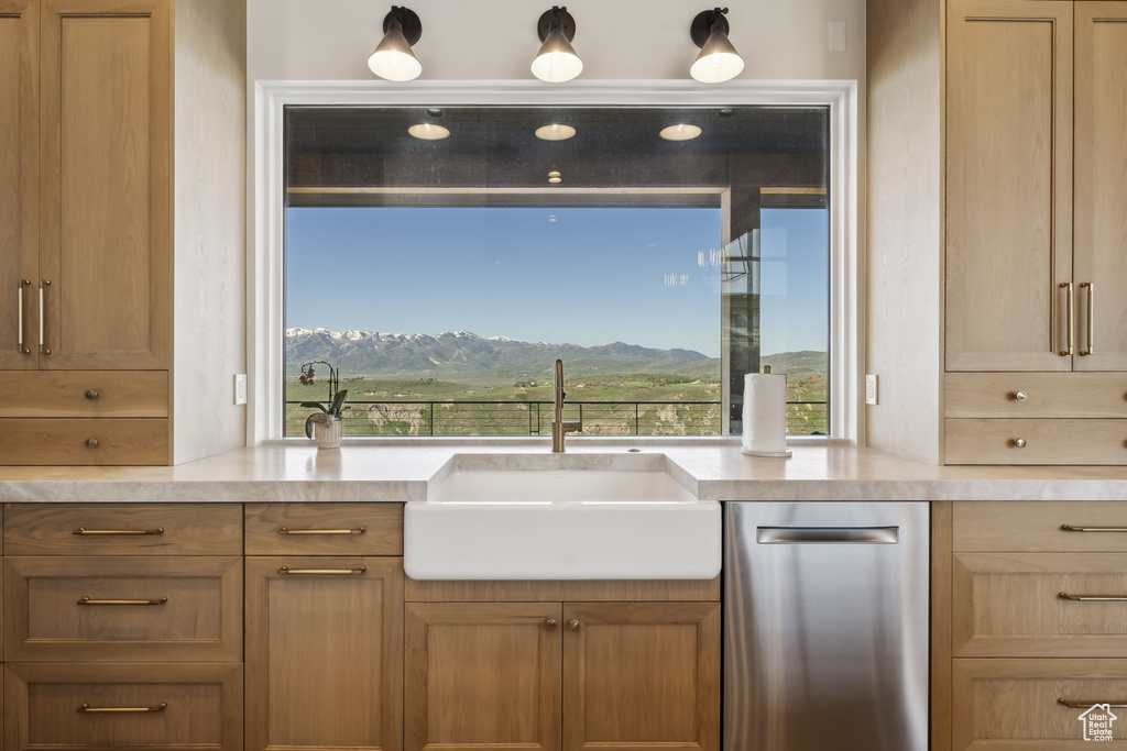 Kitchen featuring dishwasher, a mountain view, and light countertops