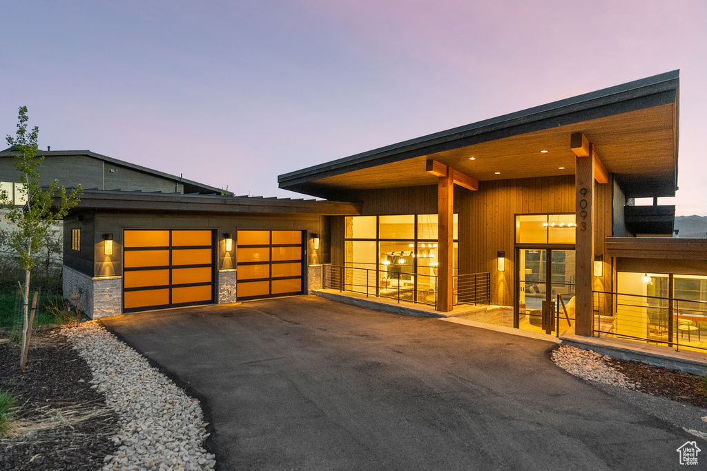 Garage with asphalt driveway