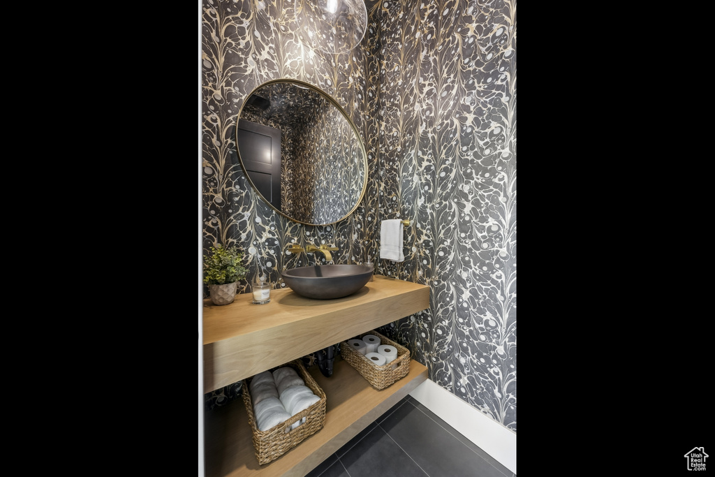 Bathroom view of wallpapered walls