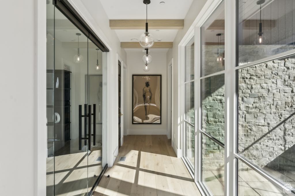 Hall featuring wood finished floors