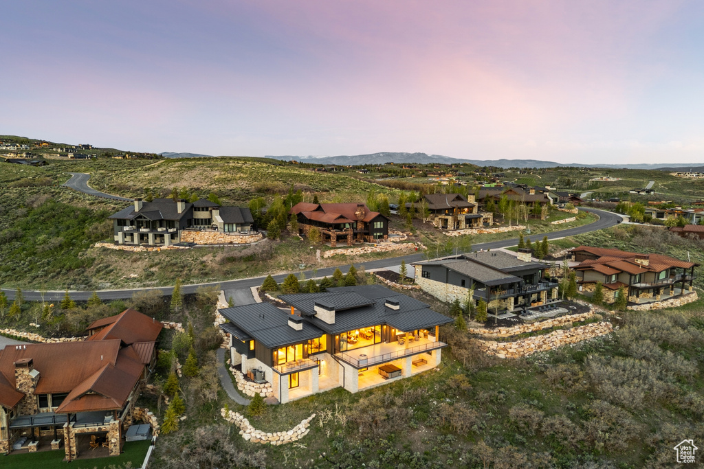 Aerial view of residential area featuring a mountain backdrop