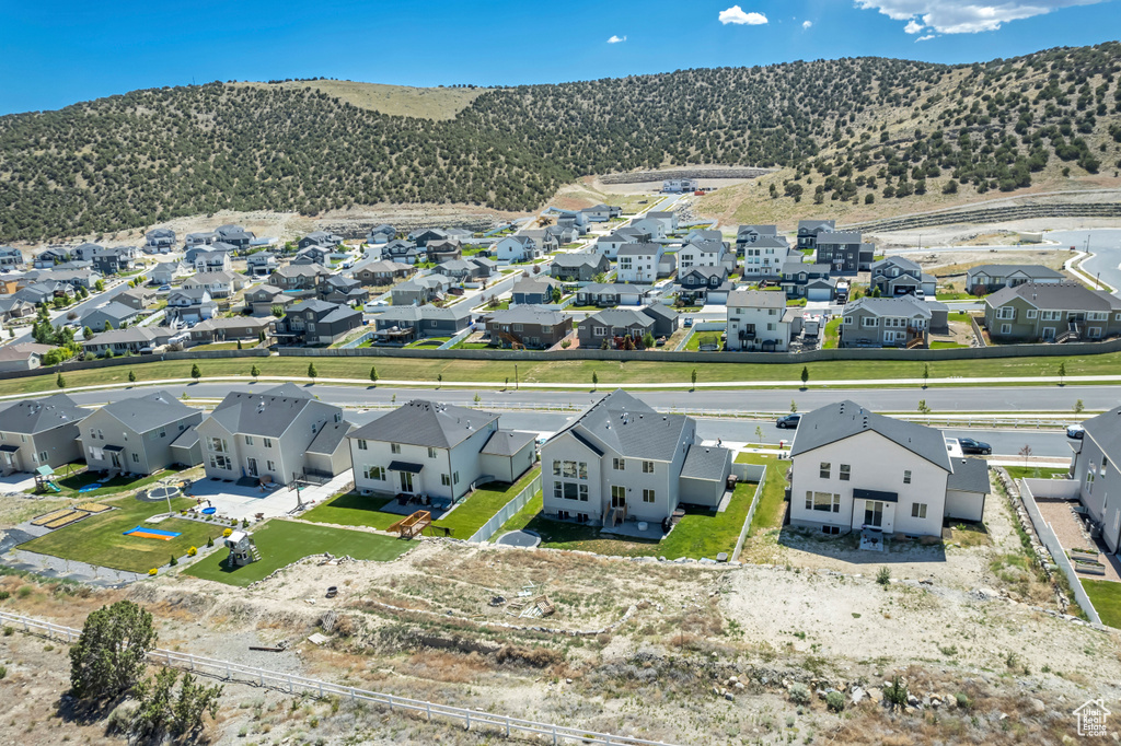 Aerial perspective of suburban area featuring a mountainous background