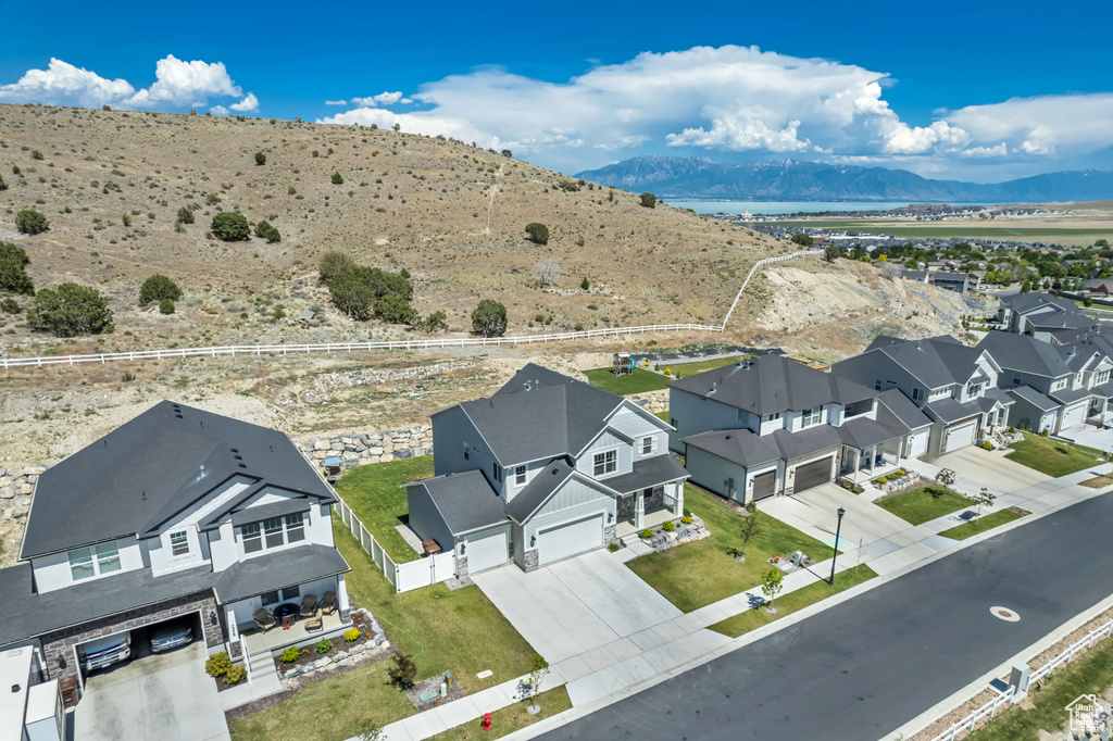 Aerial view of residential area featuring a mountainous background