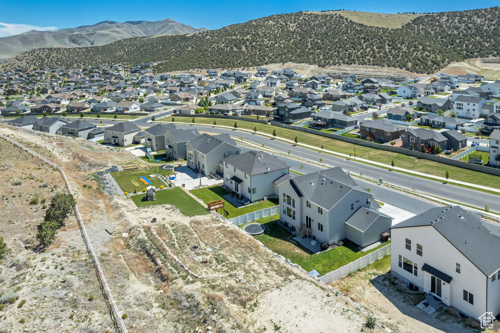 Aerial view of residential area featuring a mountain backdrop