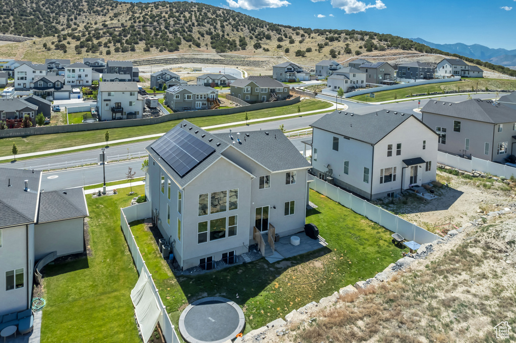Aerial view of residential area with a mountainous background