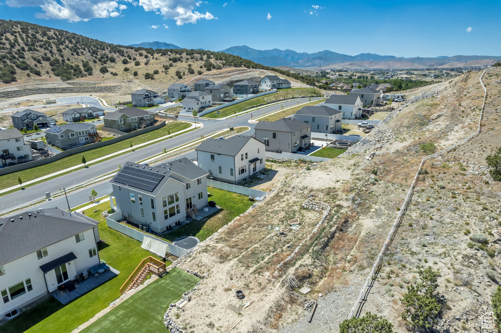 Aerial perspective of suburban area featuring a mountain backdrop