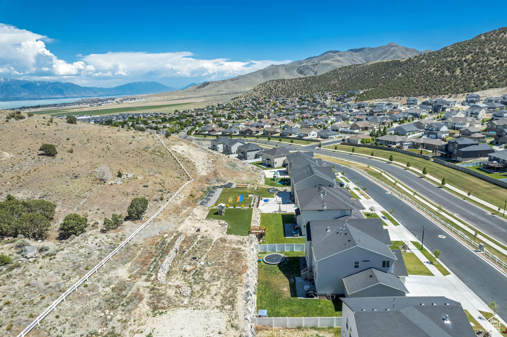 Aerial perspective of suburban area with a mountainous background