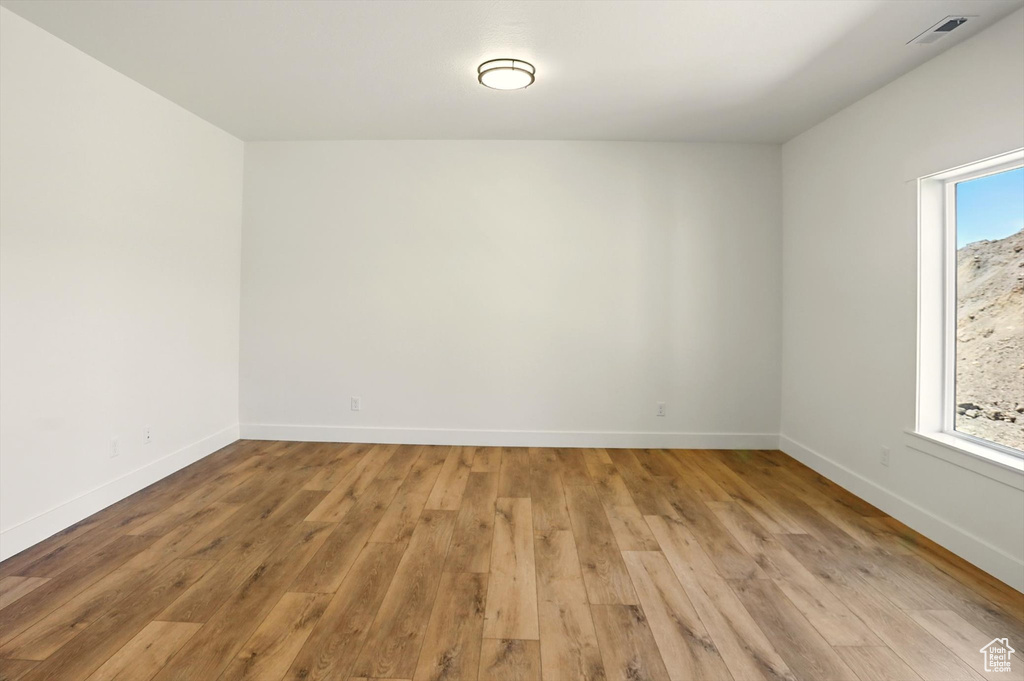 Unfurnished room with light wood-style floors