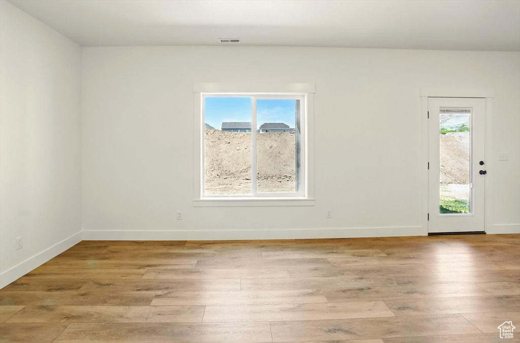 Empty room with light wood-style floors