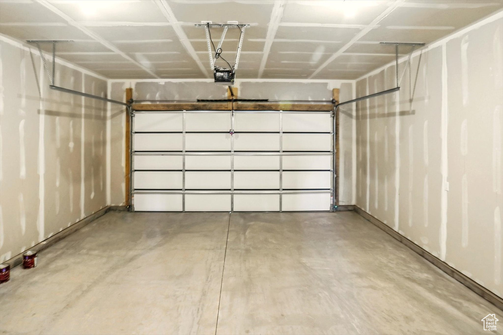 Garage featuring a garage door opener