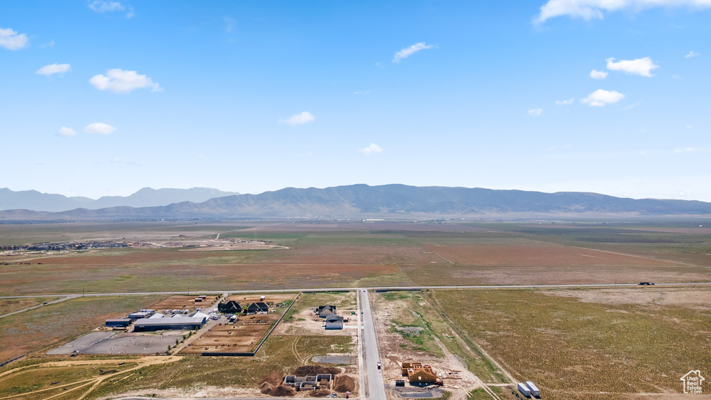 Overview of rural landscape featuring a mountain backdrop