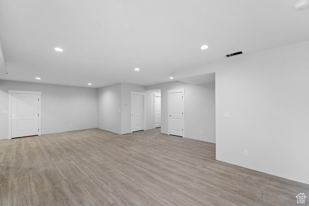 Basement featuring recessed lighting and light wood-type flooring