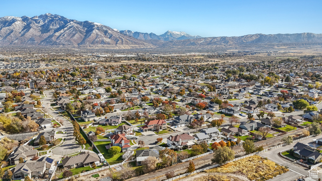View of property location featuring a mountain backdrop and nearby suburban area