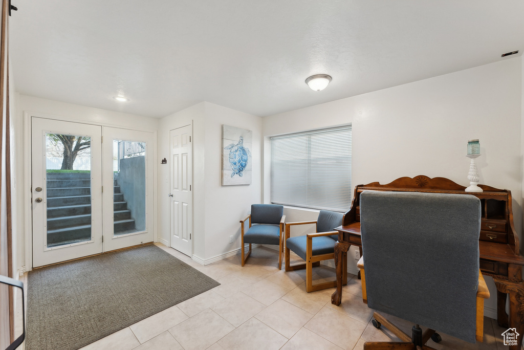 Office area with plenty of natural light and light tile patterned flooring