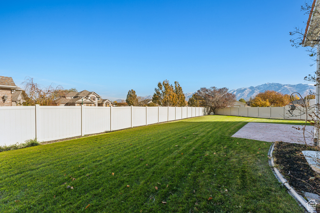 Fenced backyard featuring a patio area