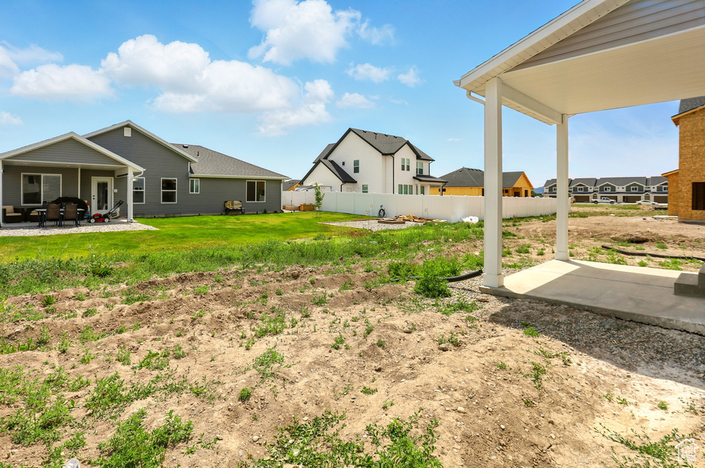 View of yard with a patio area and a residential view