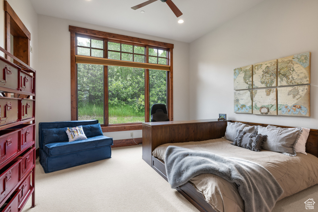 Carpeted bedroom featuring recessed lighting and ceiling fan