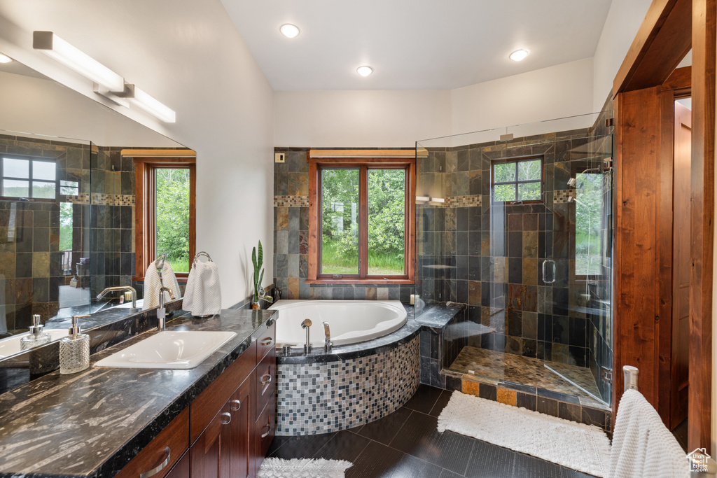 Bathroom with a garden tub, vanity, tile patterned floors, a stall shower, and recessed lighting