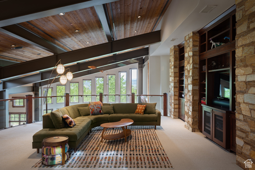 Carpeted living room featuring wood ceiling and recessed lighting