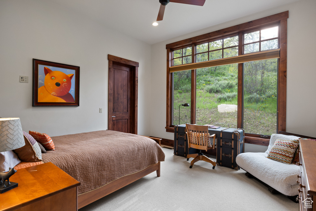 Carpeted bedroom featuring recessed lighting and a ceiling fan