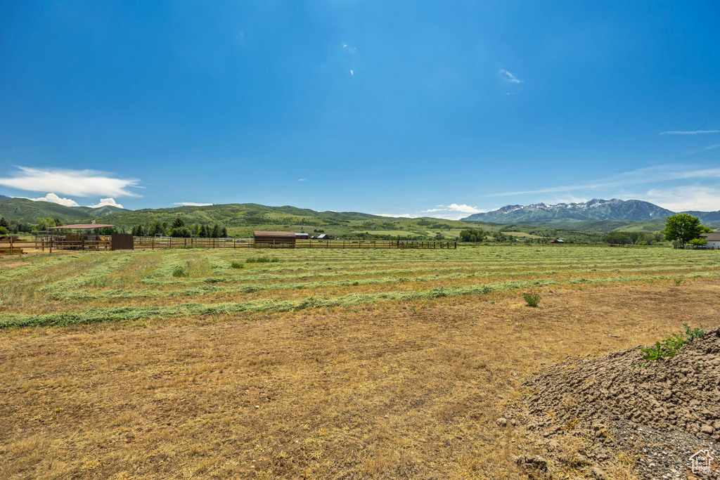View of mountain backdrop featuring rural landscape