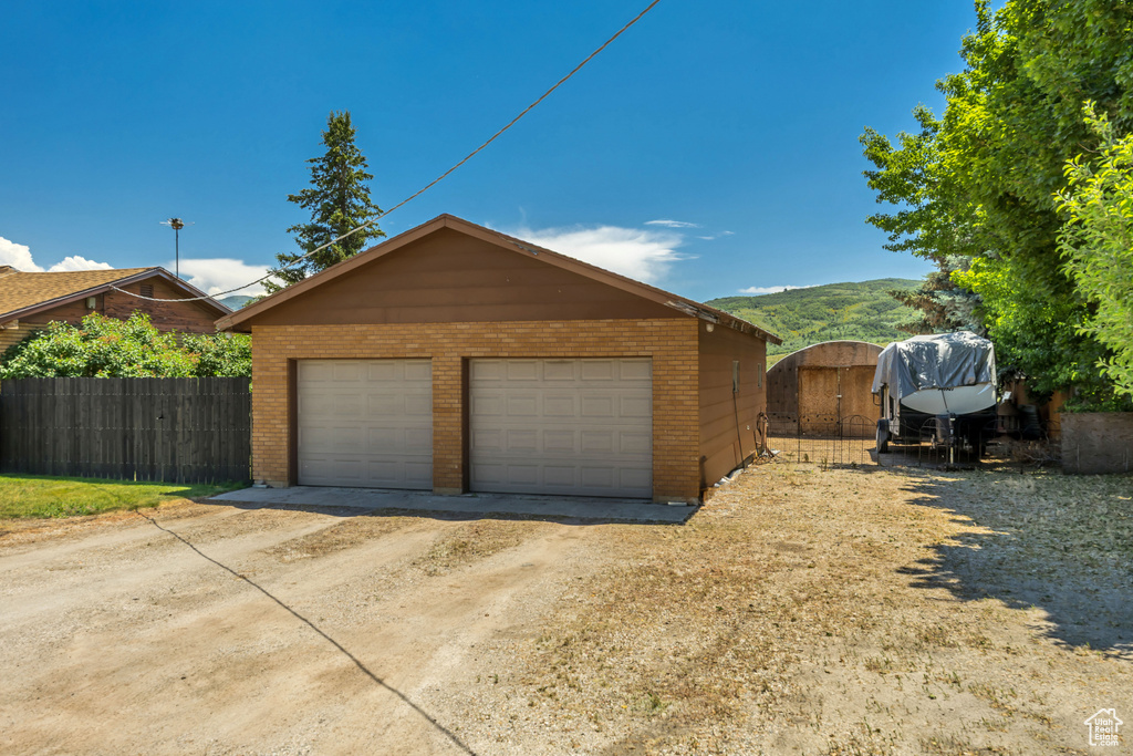 Detached garage with a mountain view
