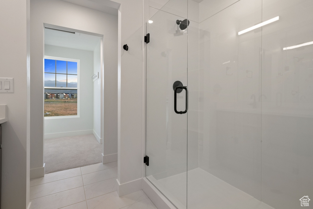 Bathroom featuring a stall shower and tile patterned floors