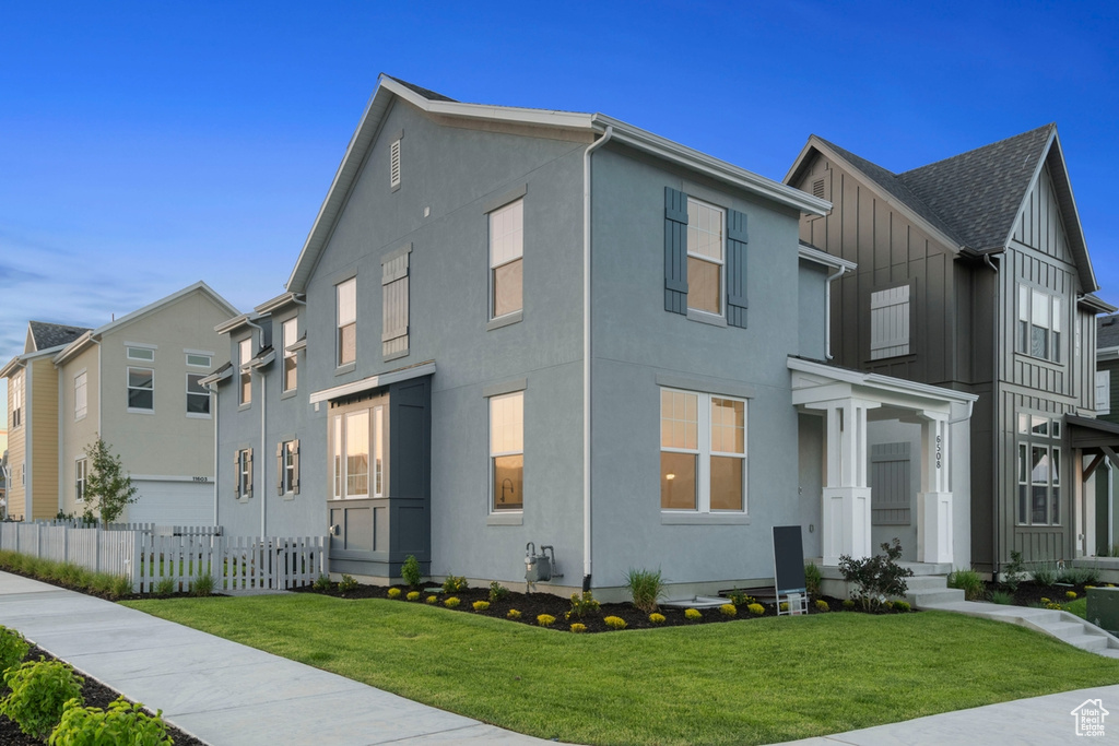 Townhome / multi-family property with stucco siding and board and batten siding