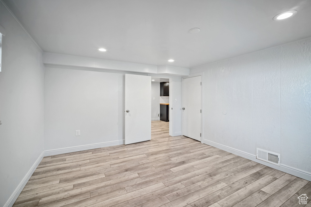 Unfurnished bedroom featuring light wood-style flooring, recessed lighting, and baseboards