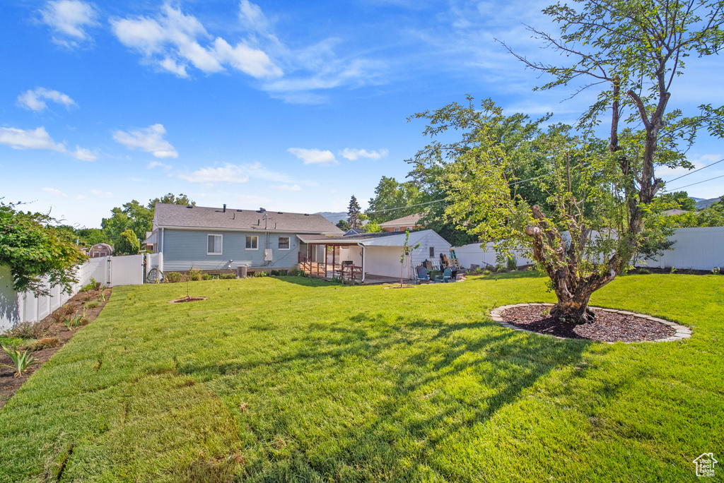 View of yard featuring a sunroom