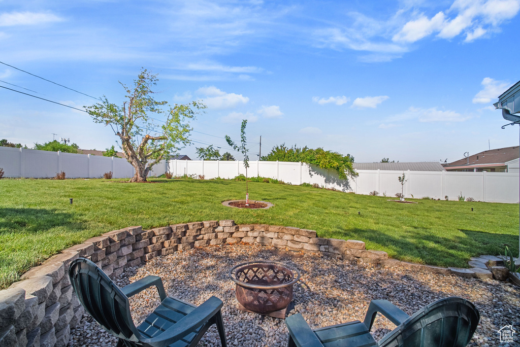 View of patio featuring a fire pit